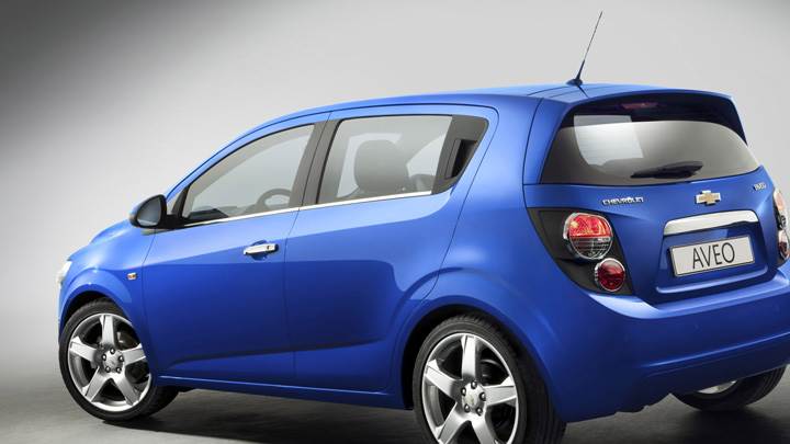 Side Back Pose Of 2012 Chevy Aveo In Blue